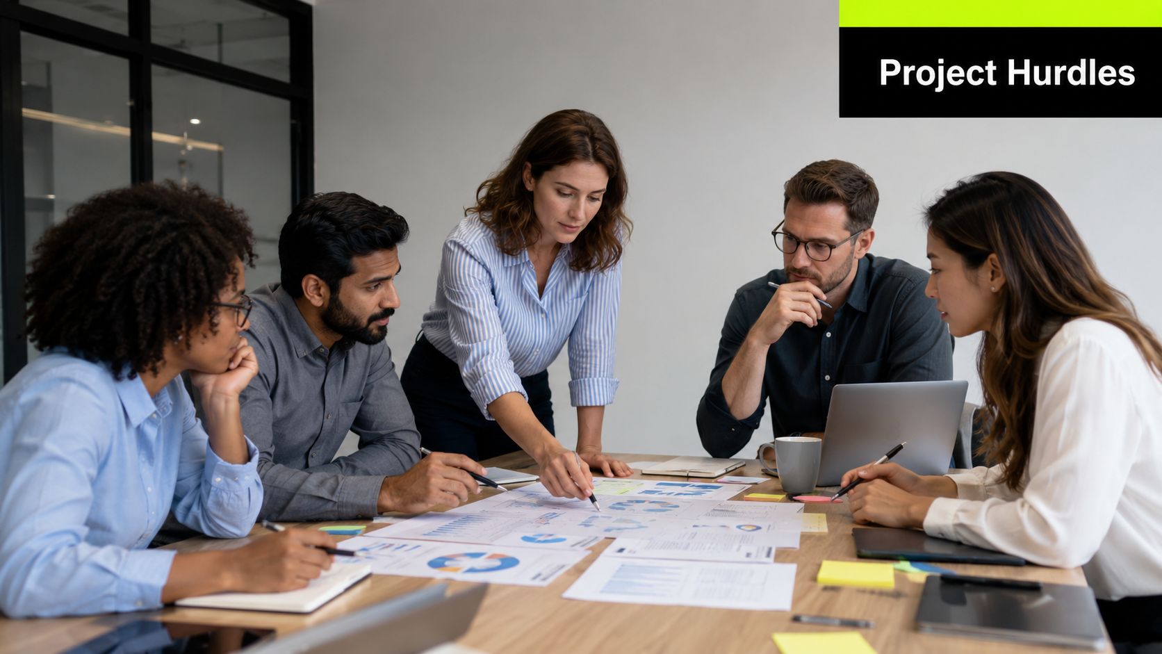 A diverse group of professionals collaborating and reviewing financial charts during a business strategy meeting in an office.